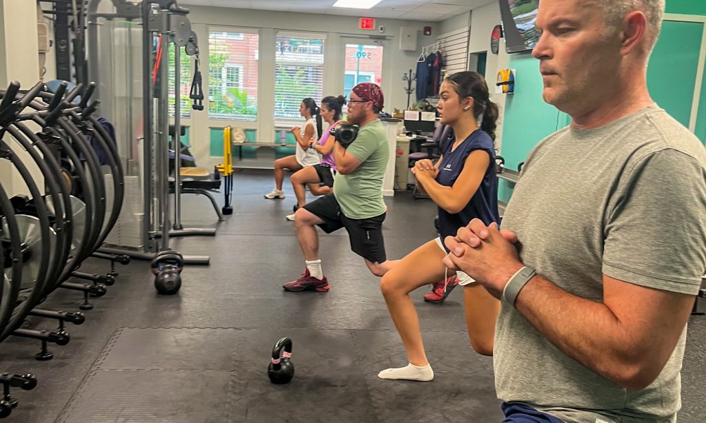 Small group adult functional strength training session at Passion for Fitness in Chester County, with clients from Phoenixville, Exton, Downingtown, and Collegeville improving real-world strength.